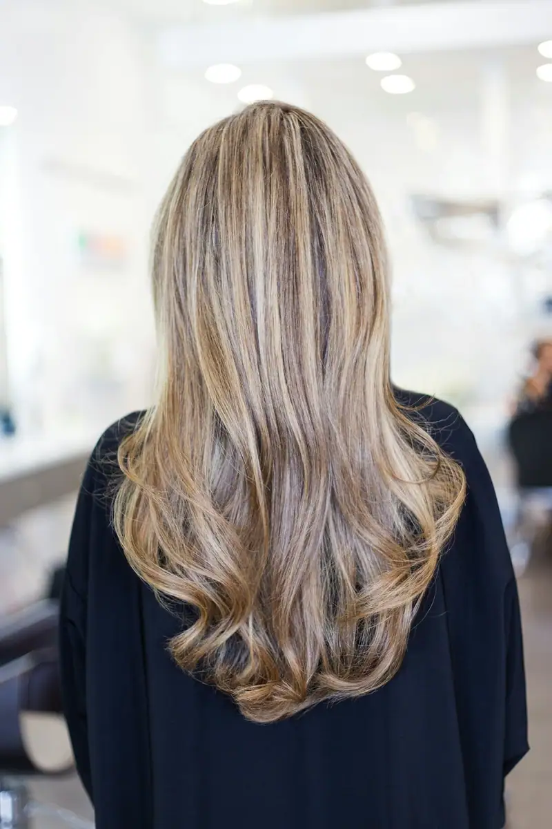 Long blonde highlighted hair seen from behind