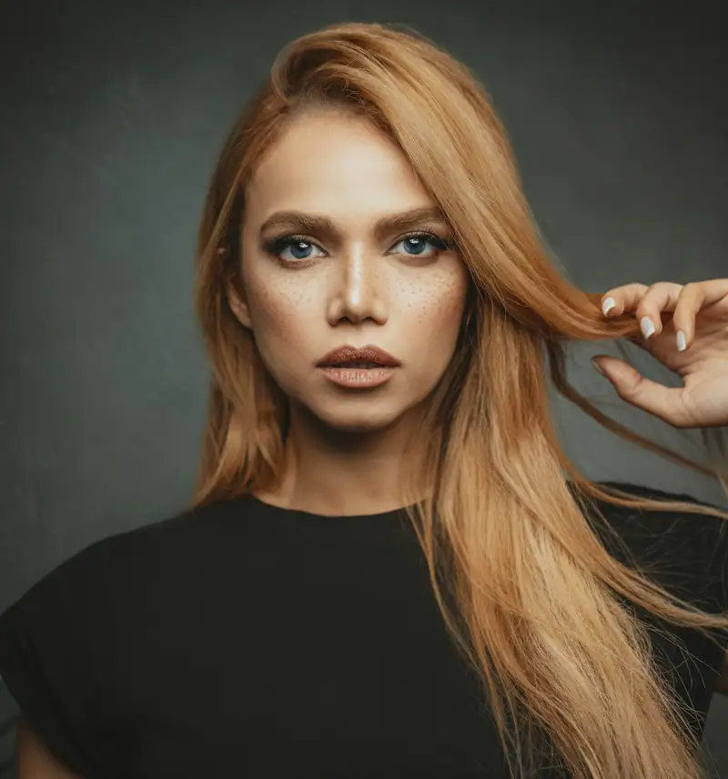 Portrait with long golden-copper hair