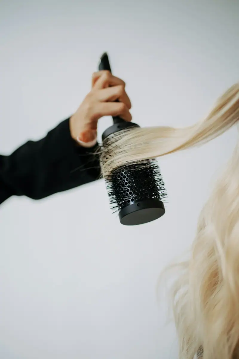 Round brush styling blonde hair