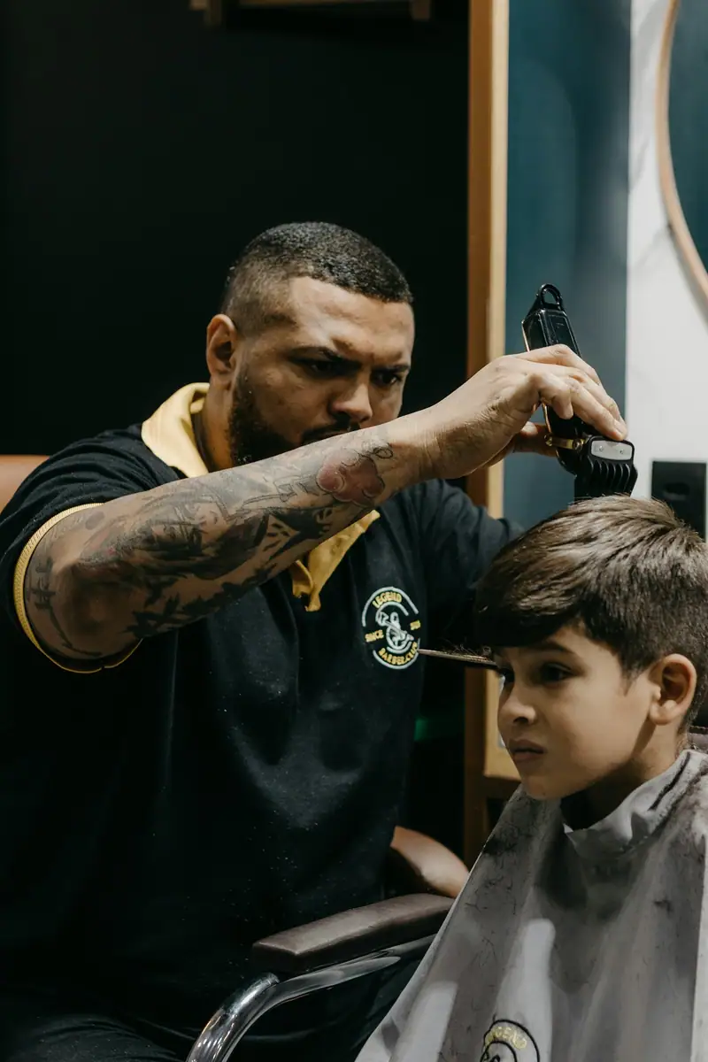 Barber trimming a child's hair