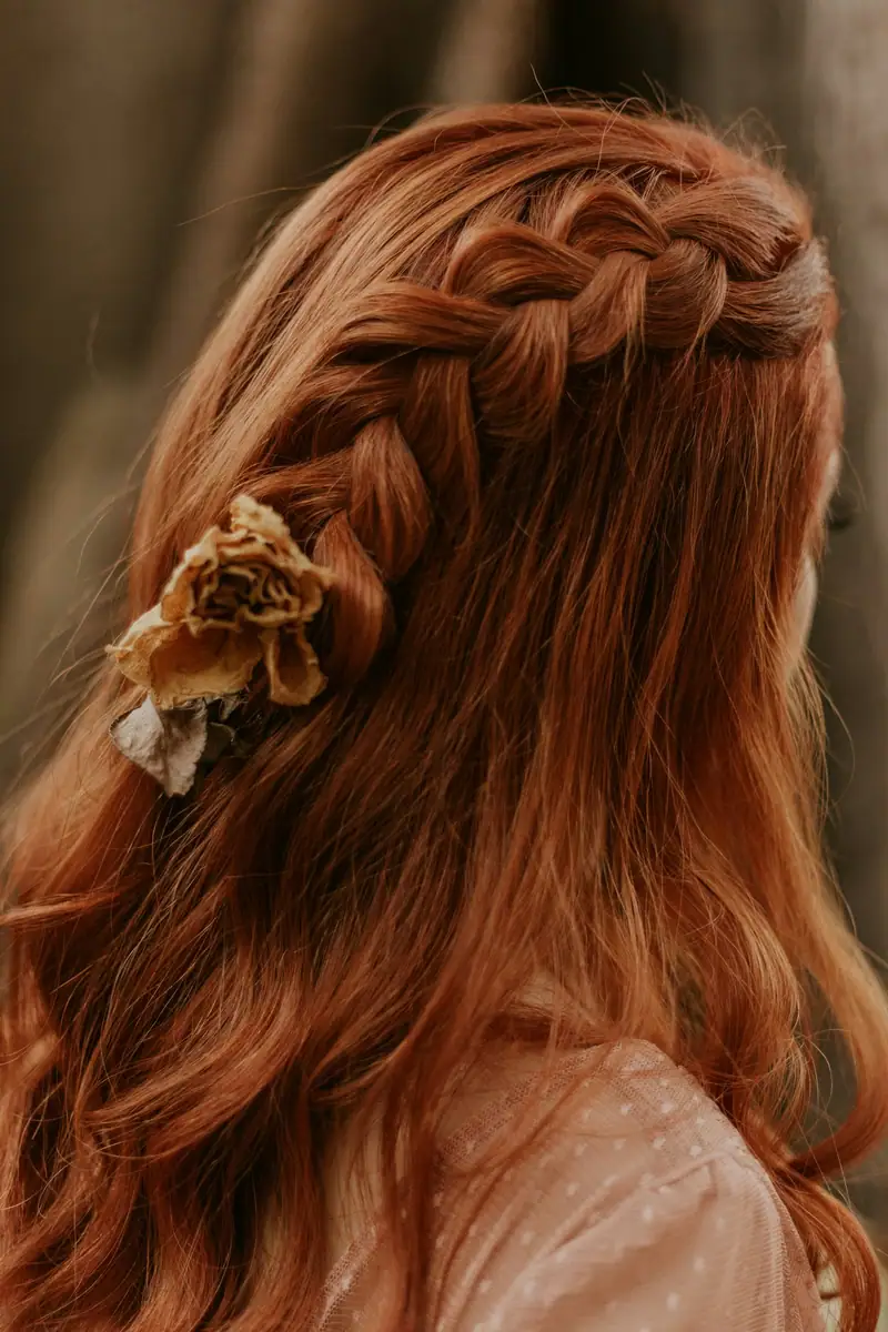 Copper hair in a loose side braid