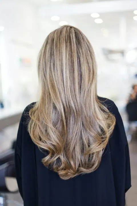 Long blonde hair, bright salon