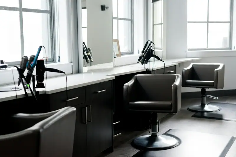 Bright salon with black chairs and window light