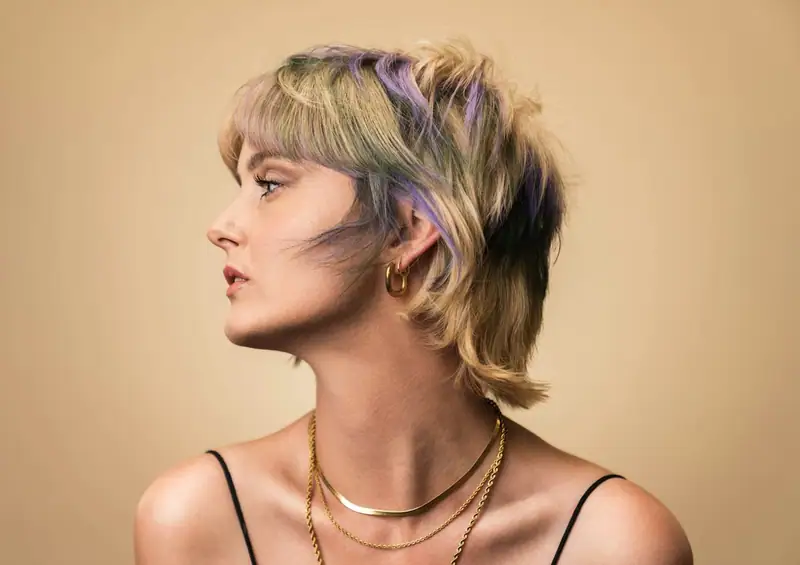 Profile of a short layered cut with soft colour