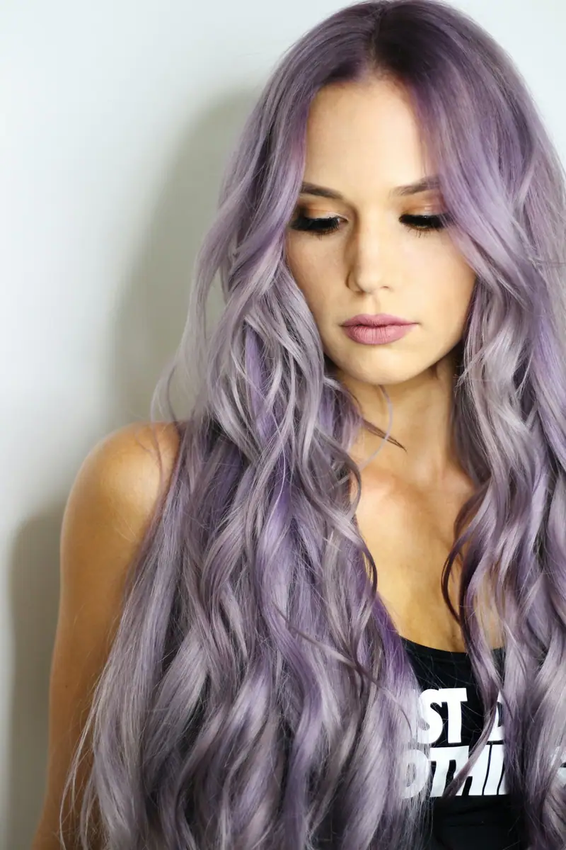 Long lavender waves on a woman looking down